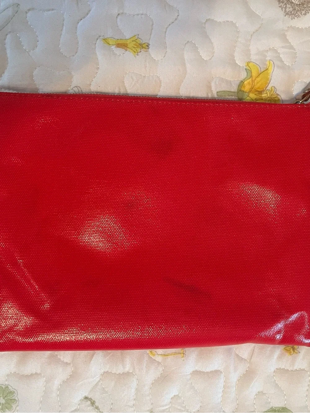 kate spade red travel pouch with gold logo plate